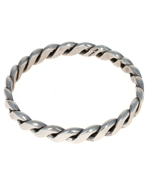 Silver twisted ring on a white background